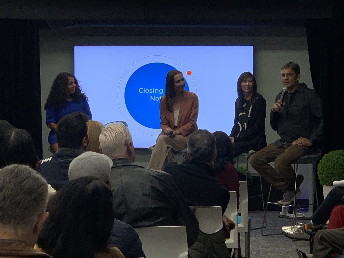 A four-person panel on stage at the TLEX Mastermind in Palo Alto, with a full audience in front