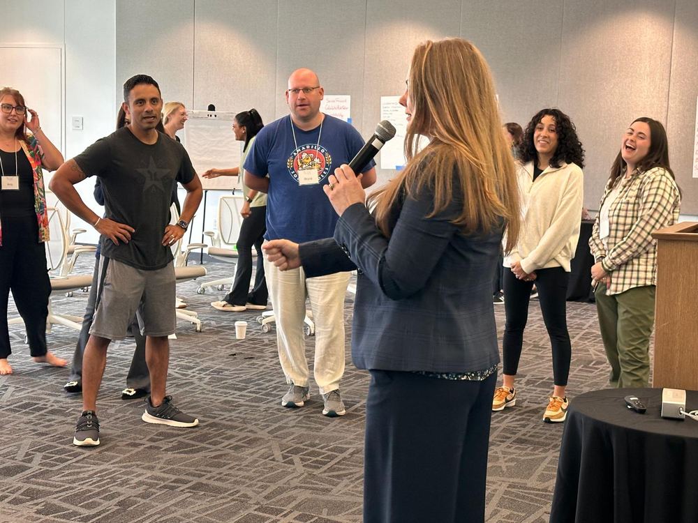 A TLEX facilitator leading a group of leaders