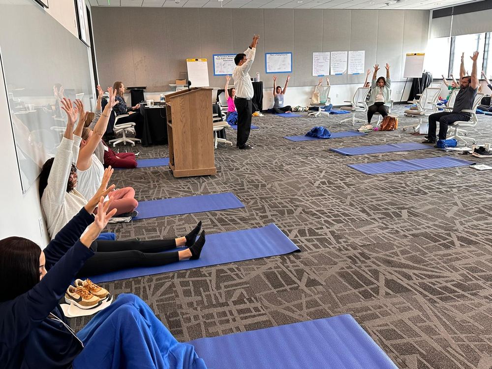 Participants stretching on mats